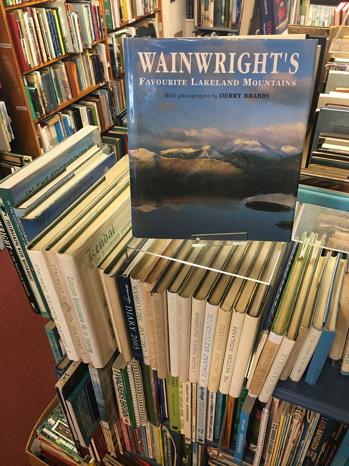 The Wainwright pictorial guides shelf on the upstairs landing at Beckside Books, Penrith